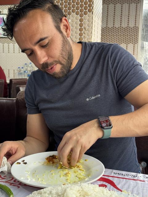 Eating rice and curry Bangladeshi-style with the right hand