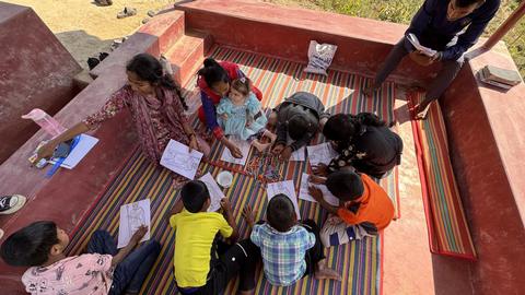 Children’s coloring activity on a rooftop veranda